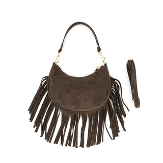 Chocolate brown suede crescent shoulder bag featuring long, dramatic suede fringe along the bottom and sides. The bag has a top zipper closure, gold-tone hardware clips, and a short suede shoulder handle, shown alongside an optional matching adjustable long crossbody strap on a plain white background.
