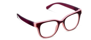 Three-quarter angled studio view of Peepers "Buffy Progressive" reading glasses set against a plain white background. The full-rim acrylic frames feature a striking two-tone color block design with a soft pastel pink inner and outer lining surrounding a deep cherry red front frame. Designed with a stylish rounded square silhouette, clear progressive lenses, durable spring hinges, and smooth, deep cherry purple temple arms with curved tips.