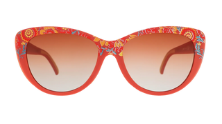 Front view of the Goodr Prairie Mystique Garden Party Crasher sunglasses against a transparent background. The eyewear features a bold red, softly rounded cat-eye frame decorated with a vibrant, vintage-inspired botanical pattern in shades of yellow, orange, and teal. The lenses offer a warm, amber-to-clear gradient tint.