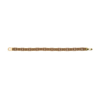 Flat, horizontal view of an elegant brown and gold-tone stretch belt set against a crisp white background. The accessory features a structured brown elastic band adorned with a continuous pattern of interlocking brown oval motifs, each outlined in polished gold-tone metal. The belt showcases a smooth, solid gold-tone hook buckle clasp closure on the ends, combining a modern geometric design with functional, comfortable wear.