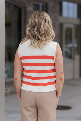 Back view of the Côte d'Azur Knit Top in Orange, showcasing the consistent stripe alignment and the clean-finished armholes. The breathable sleeveless design is evident, making it an ideal choice for warm-weather layering or as a standalone boutique statement piece.