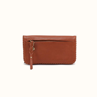 Front view of a rectangular, cognac brown leather wallet against a solid white background. The front face features a horizontal zipper pocket positioned near the top, secured with a long, braided leather zipper pull and accented with a small antique brass logo charm. The wallet is framed with artisanal, tonal leather whipstitching along the side and bottom edges, while standard structural stitching forms a neat rectangle on the lower front panel, highlighting the natural, supple grain of the leather.