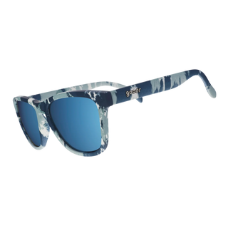 Angled side view of the Goodr Acid Wash Aficionado sunglasses against a white background. This perspective highlights the continuous blue and white acid-wash pattern extending seamlessly down the temple arms. The classic "goodr" logo is embedded in metallic text on the temple arm, while the curved reflective blue lenses complete the retro, denim-inspired aesthetic.