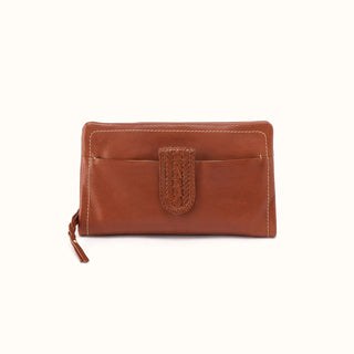 Front view of a rectangular brown leather wallet featuring a distinctive woven leather center tab closure over a convenient front slip pocket. The smooth, cognac-toned leather is accented with prominent cream contrast stitching outlining the top and side edges, and is finished with a matching braided leather zipper pull hanging from the left side, all presented against a crisp white studio background.